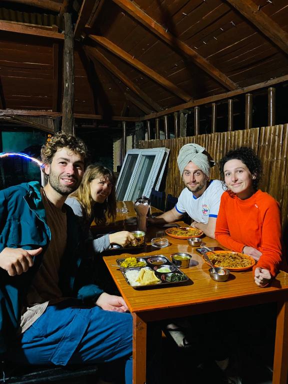 Travelers sharing a meal at Hotel Tiger's Den restaurant